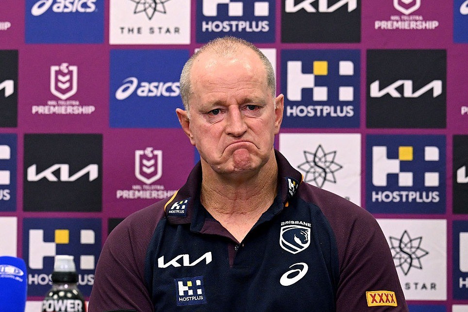 Brisbane Broncos players walking from the field after a loss