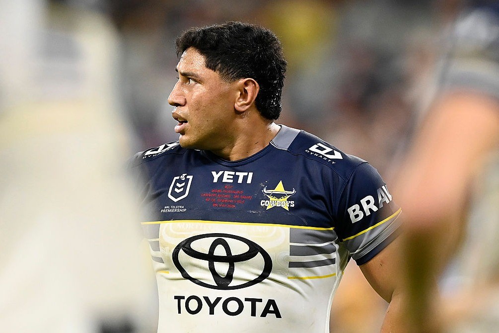 An NRL player braced in a defensive line during a finals-round match