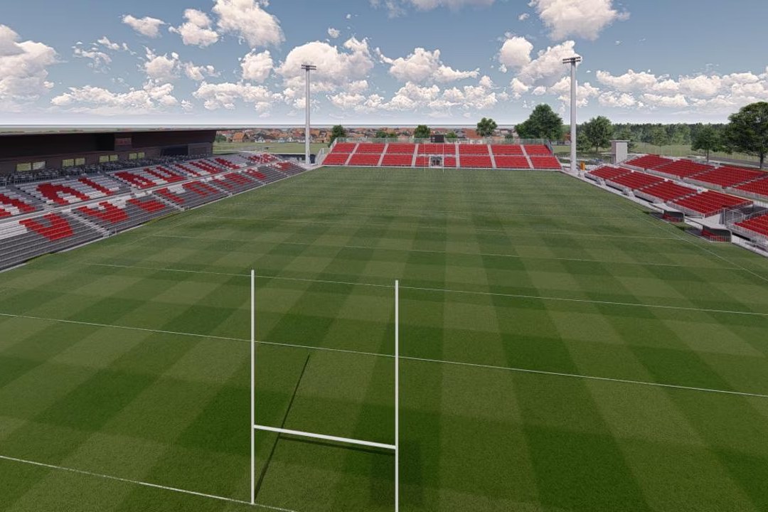 Kayo Stadium empty in daylight, goalposts in the foreground and REDCLIFFE picked out in white across the red seating