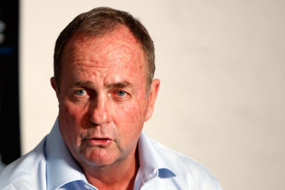 Coach Peter Sharp watching on from the sideline at an NRL match