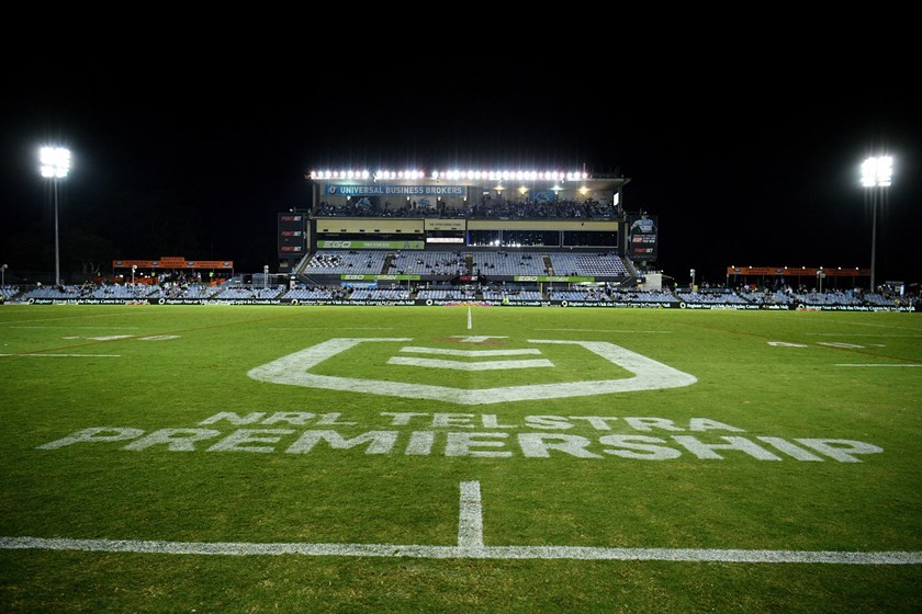 Shark Park, Ocean Protect Stadium, empty under floodlights at night with NRL TELSTRA PREMIERSHIP painted across the halfway line